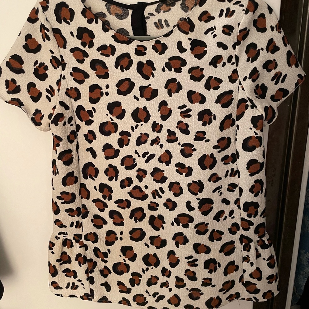 Cheetah print top with slight flair at the bottom